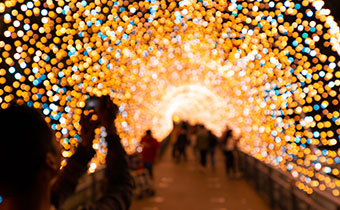 People photographing holiday lights